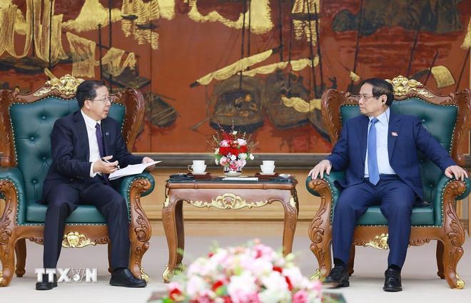 Thủ tướng Phạm Minh Chính tiếp ông Bành Cương Bình, Chủ tịch Công ty hữu hạn Tập đoàn Khoa học Kỹ thuật Hoa Điện Trung Quốc. (Ảnh: Dương Giang/TTXVN) ttxvn-thu-tuong-tiep-chu-tich-cong-ty-hoa-dien-2.jpg