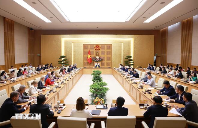 Thủ tướng Phạm Minh Chính làm việc với Đoàn Hội đồng kinh doanh Hoa Kỳ-ASEAN. (Ảnh: Dương Giang/TTXVN) ttxvn-thu-tuong-lam-viec-voi-doan-hoi-dong-kinh-doanh-hoa-ky-asean-1107-1.jpg
