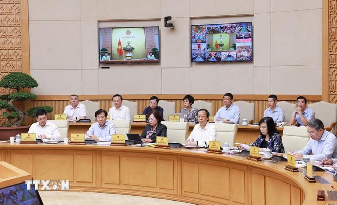 Đại diện các bộ, cơ quan thuộc Chính phủ tham dự phiên họp. (Ảnh: Dương Giang/TTXVN) ttxvn-hop-chinh-phu-thang-7-3.jpg