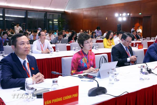 Các đại biểu tham dự buổi họp báo. (Ảnh: Phạm Kiên/TTXVN) ttxvn-hop-bao-dai-hoi-dai-bieu-dang-bo-chinh-phu-lan-thu-nhat-8336466-7.jpg
