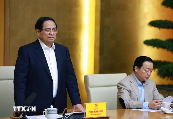 Thủ tướng Phạm Minh Chính chủ trì họp triển khai “Chiến dịch Quang Trung” thần tốc xây dựng nhà ở cho các gia đình bị thiệt hại do thiên tai tại miền Trung. (Ảnh: Dương Giang/TTXVN) ttxvn-0912-thu-tuong-xay-nha-vung-lu-3.jpg